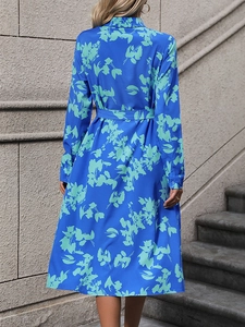 Royal blue A-line midi shirt dress with green floral print and matching waist belt back view