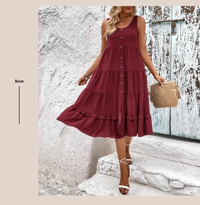 Detail view of burgundy sleeveless tiered dress with button front in a casual resort style