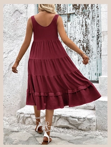 Detail of burgundy sleeveless tiered dress featuring a U-back and crinkle texture
