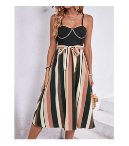 Detail of striped midi dress featuring a ribbed top and elegant golden chain strap