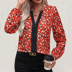 Women's V-neck floral long sleeve blouse with contrast black trim and elastic cuffs