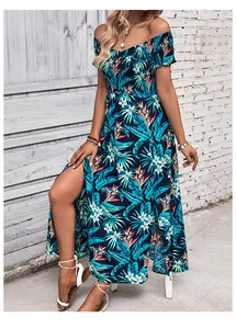 Detail of tropical floral print on off-shoulder maxi dress with high side slit