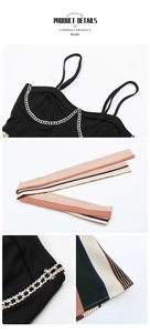 Close-up of black ribbed top with silver chain detail and multicolor striped fabric