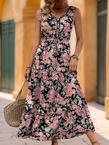 Close-up of V-neck sleeveless floral maxi dress with lace trim and tiered cake skirt detail