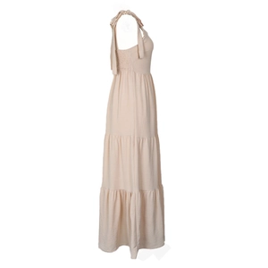 Detail of adjustable bow shoulder straps and elastic pleated side on the apricot tiered dress
