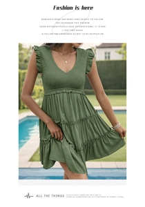 Detail of smocked bodice and V-neck on a dark green sleeveless summer ruffle dress
