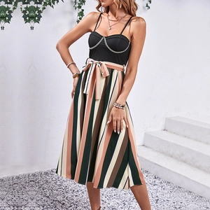 Striped A-line midi dress with black ribbed camisole top and elegant gold chain detail