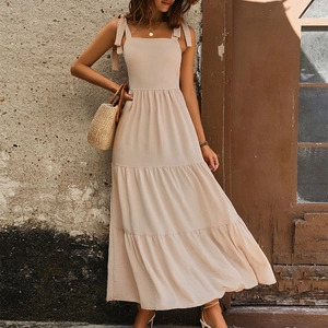 Elegant beige backless tiered maxi dress with bow shoulder straps for summer