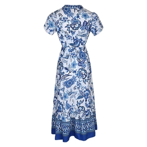 Detail view of the back of a blue floral boho dress with short sleeves and tiered hem
