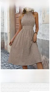 Detailed close-up of a floral halter dress with a high waist and A-line skirt fit