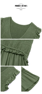 Detail of army green V-neck dress featuring ruffled edges and smocked fabric texture