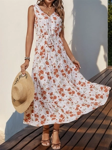 Detail of V-neck sleeveless summer dress with orange floral print and lace trim