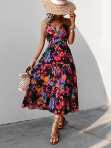 Detail of summer floral maxi dress with tiered cake skirt and bohemian print