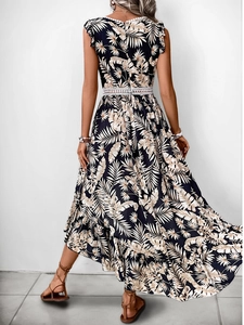 Detail of blue palm print maxi dress with white lace trim and ruffled hemline back view
