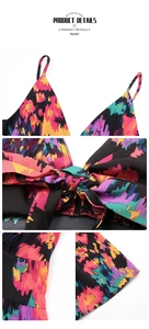 Close-up of colorful tie-dye print dress with thin straps and bow-tie chest detail
