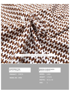 Detail of soft breathable brown houndstooth fabric with moisture wicking texture