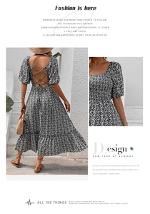 Detail of floral backless dress with puff sleeves and tie-back design for summer
