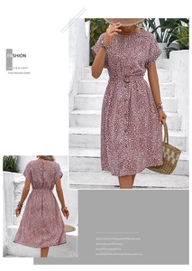 Detail of vintage polka dot dress with waist belt and button front in dark dusty rose
