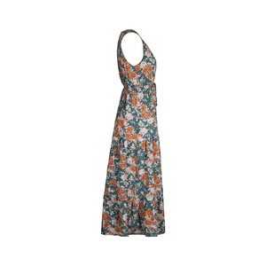Detail view of dark green tiered summer dress with orange floral print and sleeveless cut
