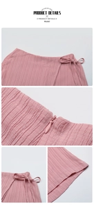 Detail showing pink textured fabric with side bow tie and invisible zipper on summer shorts
