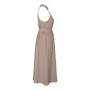 Detail side view of halter neck maxi dress with brown and white geometric wave print