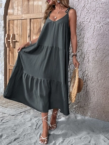 Detail of charcoal grey tiered maxi dress with adjustable straps and textured fabric