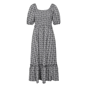 Detail of floral puff sleeve dress featuring square neck and elegant smocked bodice