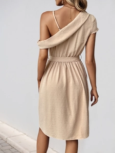 Back view of beige off-shoulder midi dress showing fine textured jacquard fabric