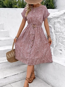 Elegant reddish-brown floral midi dress with white polka dots and a round neck belt