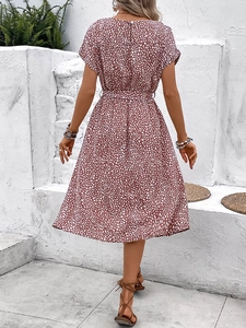 Women's summer floral dress in dusty rose with a tie waist and round neck back view