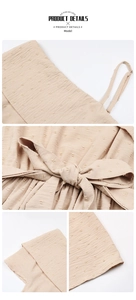 Detail view of apricot Swiss dot fabric dress with delicate straps and waist tie