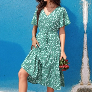 Detail of V-neck floral print dress with butterfly sleeves and ruffled tiered skirt hem