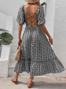 Floral backless maxi dress with puff sleeves and lace-up detail for a vintage summer look