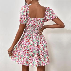 Floral summer dress with smocked waist, puff sleeves, and a square back design