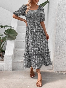 Floral backless midi dress with puff sleeves and ruffled hem on white stairs background