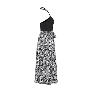 Side view of halter neck dress with black sleeveless bodice and leopard print skirt