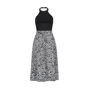 Detail of halter neck bodice joined with black and white leopard print A-line skirt