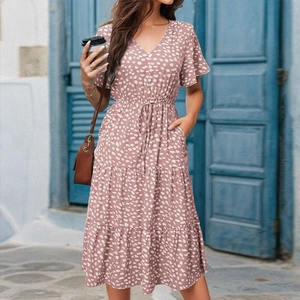 Detail of V-neck floral print dress with ruffle sleeves and tiered skirt structure