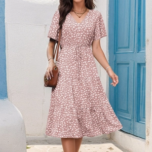 Detailed view of pink floral V-neck dress with ruffle sleeves and drawstring waist