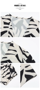 Detail of V-neckline and elastic ruffled cuffs on a black and white tropical leaf print shirt