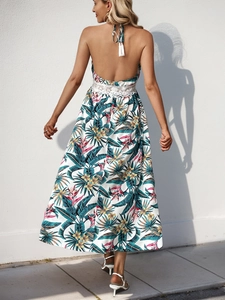 Women's backless halter maxi dress with tropical floral print and white lace waist detail