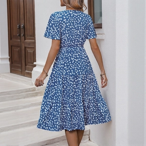 Women's royal blue v-neck summer midi dress with white polka dots and tiered skirt