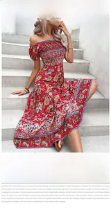 Detail of red bohemian off-shoulder dress with smocked bodice and floral patterns