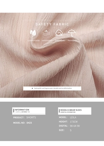Detail of pink textured fabric on summer A-line shorts showing moisture-wicking weave