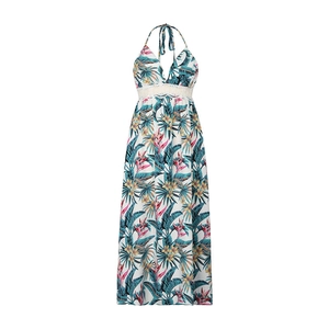 Detail of tropical palm leaf print maxi dress with white crochet lace waist and halter neck