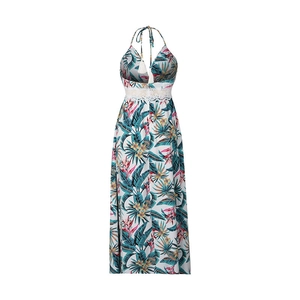 Detail of tropical print maxi dress featuring white tassel ties and crochet lace waist