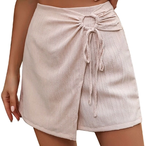Light pink textured wrap mini skirt featuring a side metal ring and tie-up detail
