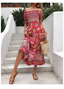 Close-up of bohemian red floral dress with off-shoulder smocked bodice and puff sleeves