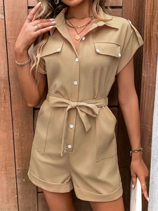 Detail of khaki romper with shirt collar, white buttons and belted high waist