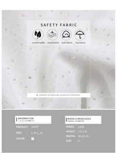 Detail of white cotton fabric showing intricate eyelet embroidery and breathable texture